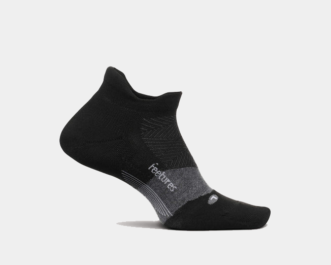 Feetures Elite Golf Max Cushion No Show Tab socks, black with gray accents and reinforced heel and toe, side view.