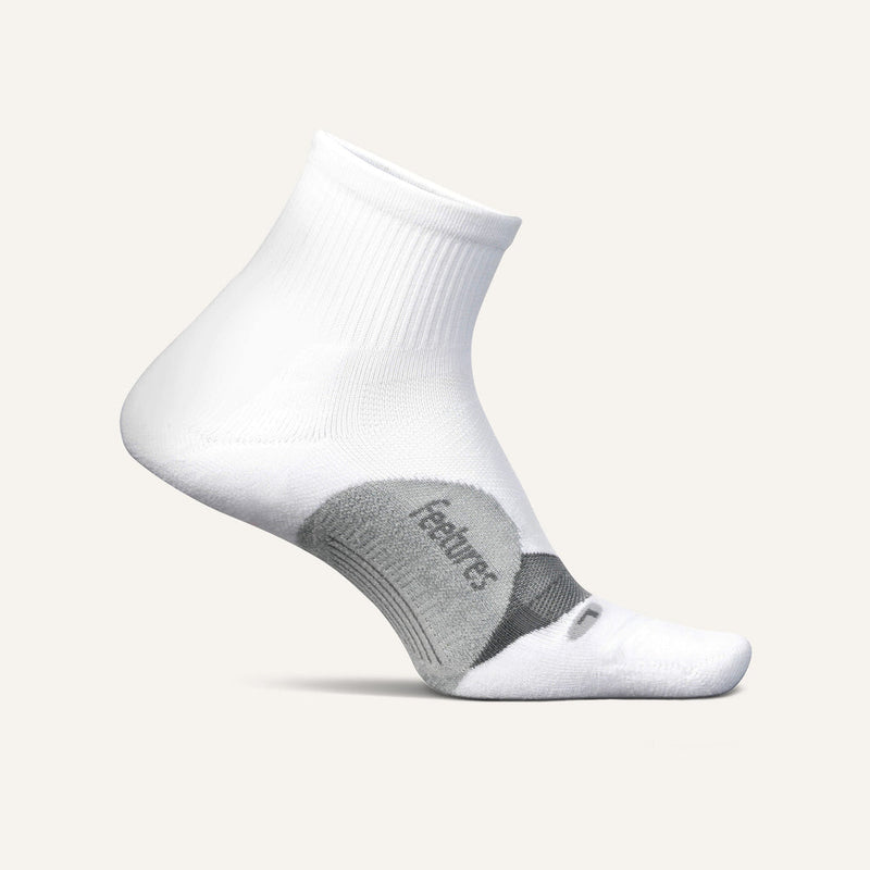 Feetures Elite Light Cushion Quarter socks in white with gray accents, side view showing arch support.