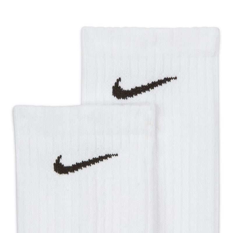 Nike Everyday Cushioned Crew Socks in white with ribbed texture and black embroidered Nike logo, close-up view.