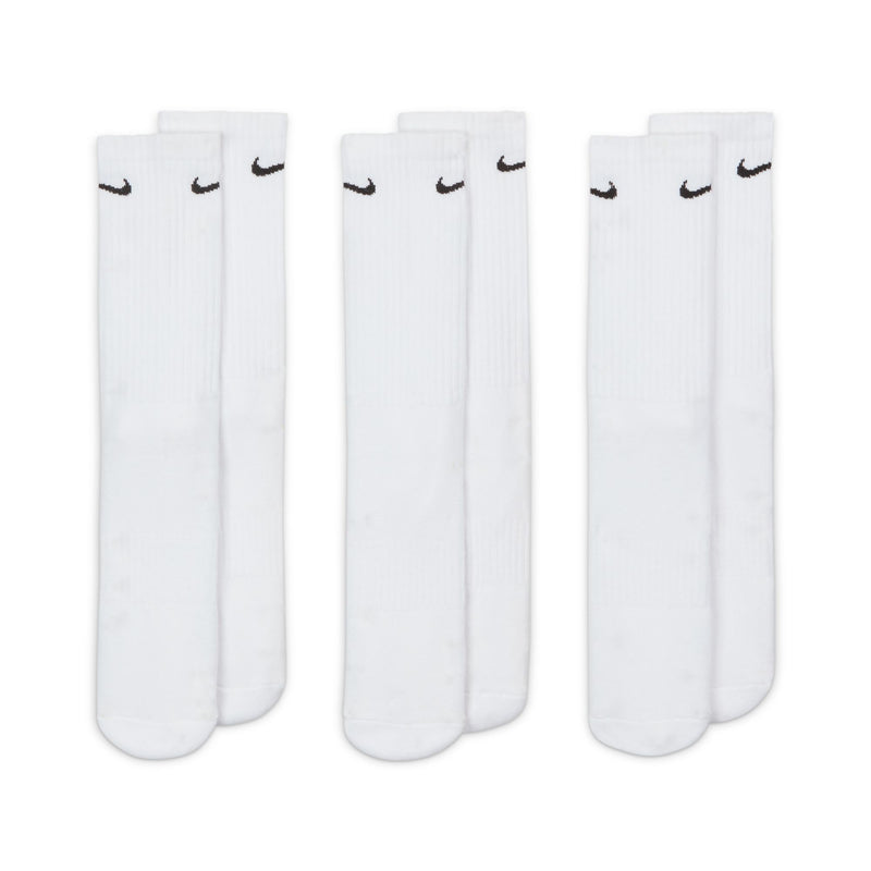 Nike Everyday Cushioned Crew Socks in white with black Nike Swoosh logo, ribbed design and cushioned sole, flat lay view.
