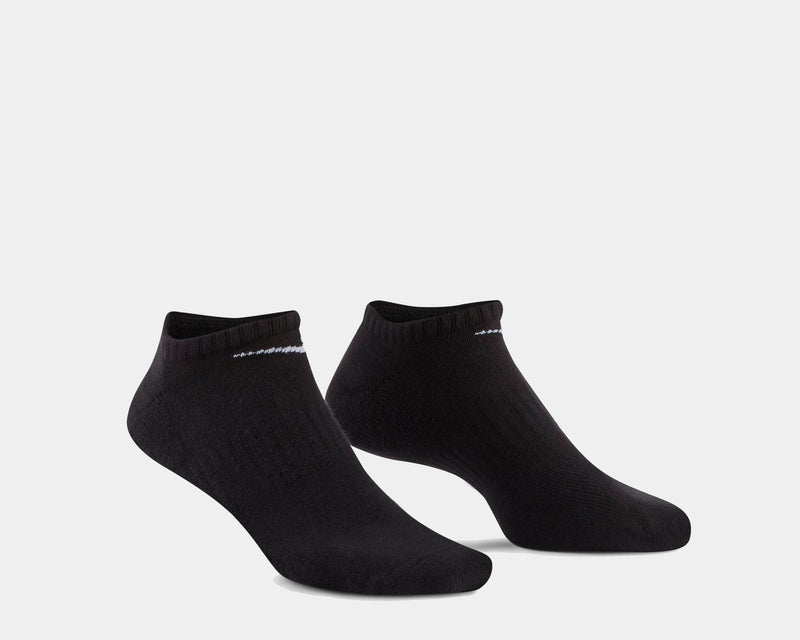 Nike Everyday Cushioned Training No-Show Socks in black with ribbed cuffs and white logo detailing, side view.
