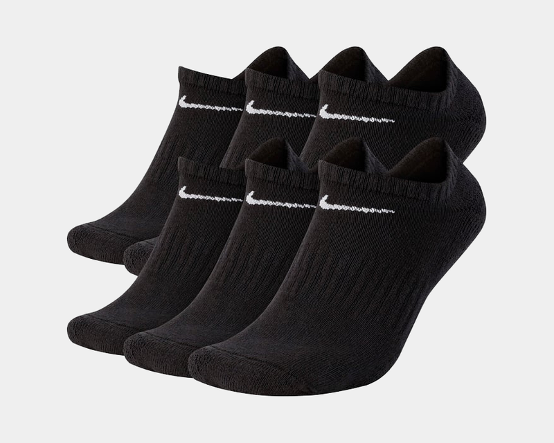 Nike Everyday Cushioned Training No-Show Socks in black with white Swoosh logo, ribbed ankle cuffs and cushioned fabric, front view.