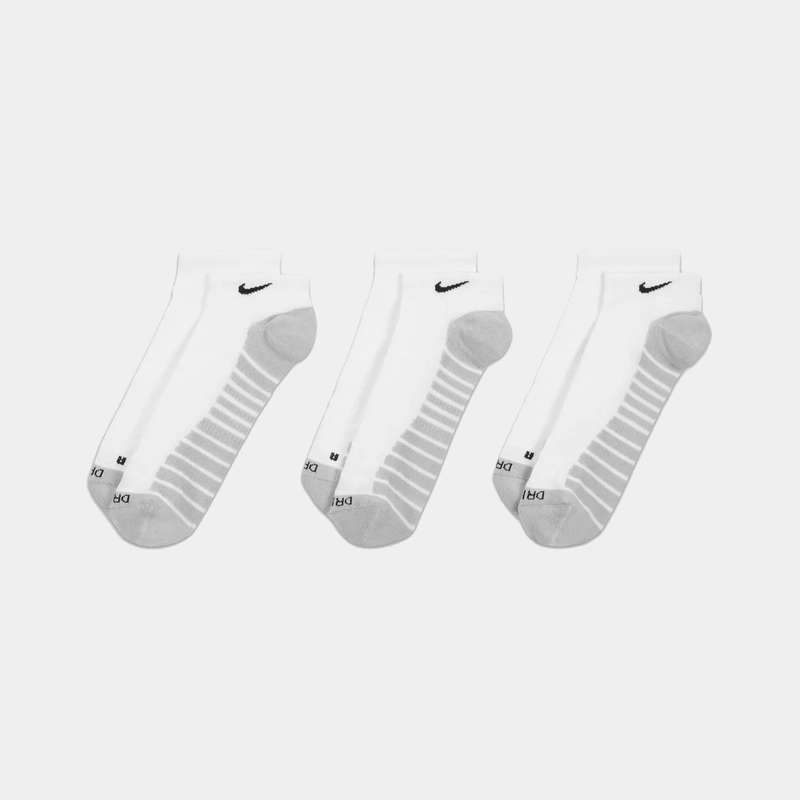 Nike Everyday Max Cushioned No Show Socks in white with black logo, ribbed arch support, and gray heel and toe, front view.