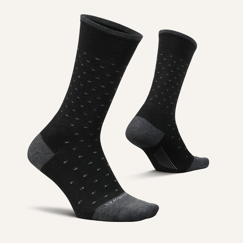 Feetures Everyday Men's Max Cushion Crew socks in black with subtle dotted pattern, reinforced gray toe and heel details, side angle view.