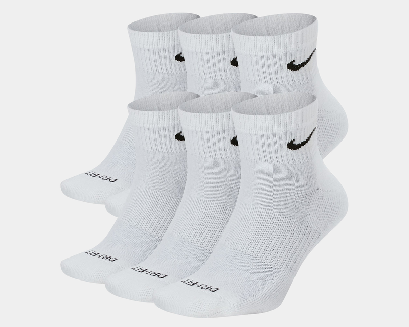Nike Everyday Plus Cushioned Ankle Socks in white with black swoosh logo, ribbed cuffs, and cushioned sole, front view.