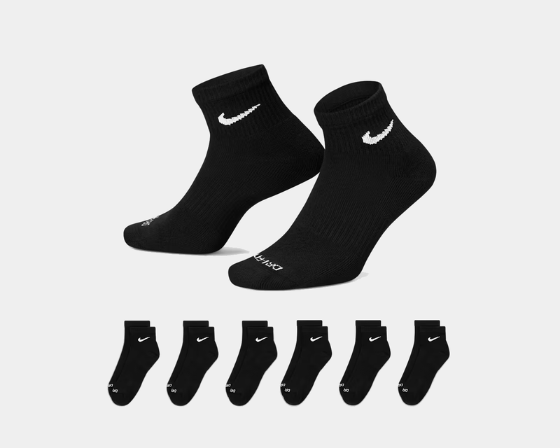 Nike Everyday Plus Cushioned Ankle Socks, black with white Nike Swoosh logo, ribbed cuffs, and cushioned sole, front and side views.
