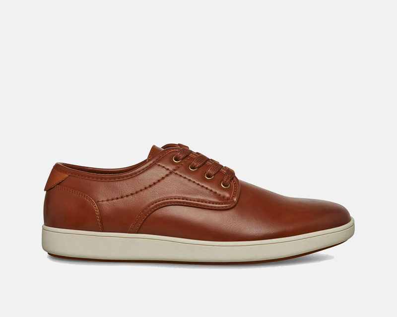 Steve Madden Fenta Leather shoes in brown leather with a sleek lace-up design and contrast white rubber sole, side view.