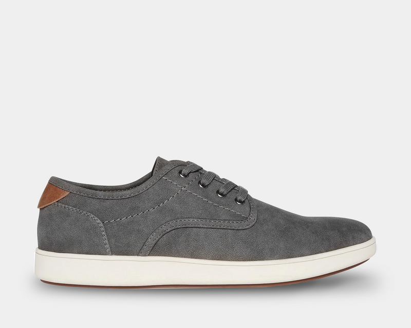 Steve Madden Fenta Suede sneakers in gray suede with a brown heel accent and white rubber sole, side view.