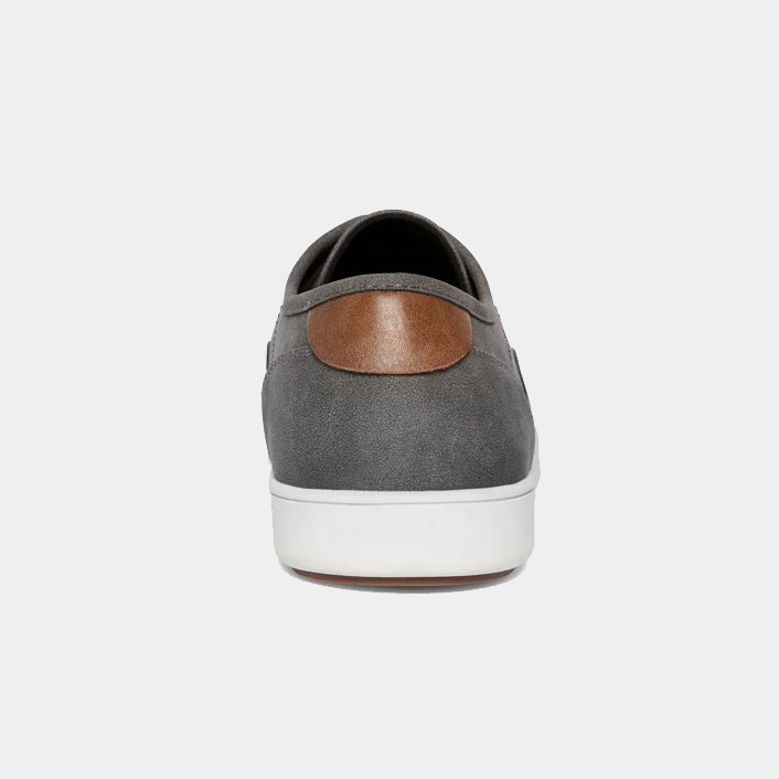 Steve Madden Fenta Suede sneakers in gray suede with brown leather accent on the heel and white rubber sole, back view.