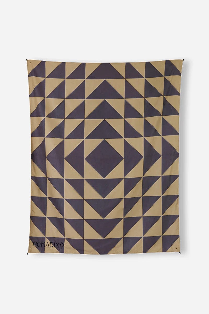 Nomadix Festival Blanket featuring beige and dark gray geometric triangle pattern, full view of lightweight multi-purpose design.