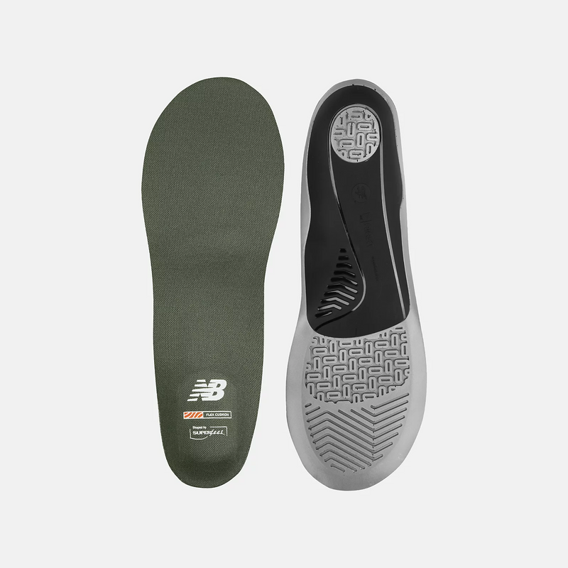 New Balance Flex Cushion Insoles in green and black with Shock Absorbing SUPERFEEL technology, top view showing textured surface and tread design.