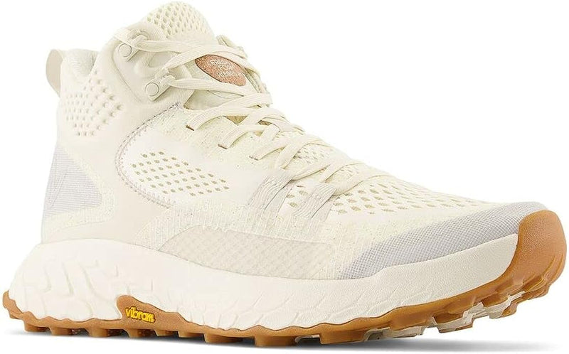 New Balance Foam X Hierro Mid GTX trail shoes in cream with a breathable mesh upper, Gore-Tex lining, and Vibram outsole, side perspective.