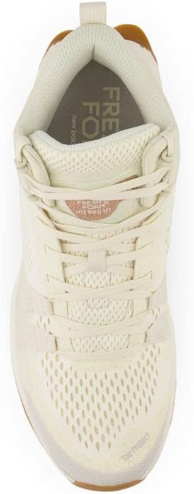 New Balance Foam X Hierro Mid GTX trail shoe in beige with a mesh upper and lace system, top view.
