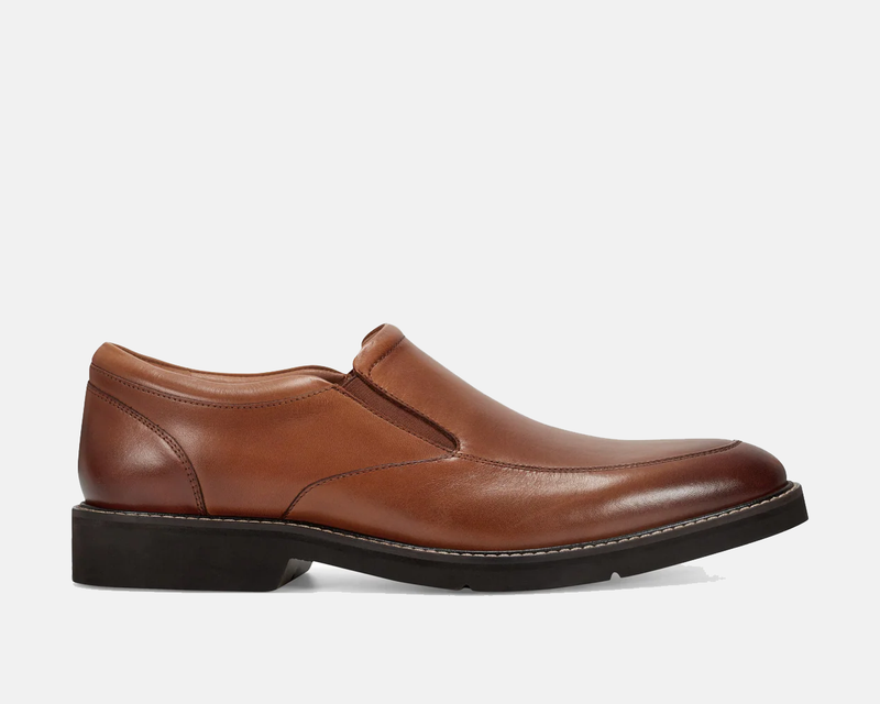 Rockport Folton Almond Toe Slip On shoes in brown leather with a sleek design and black sole, side view.