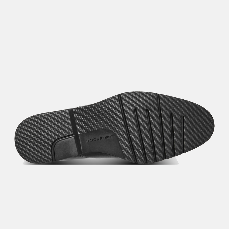 Rockport Folton Almond Toe Slip On outsole showing textured rubber tread pattern with branding detail in black.