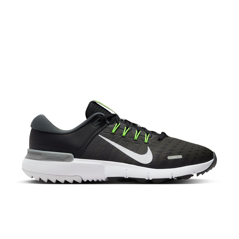 Nike Free Golf Next Nature golf shoes in black with white Nike swoosh, mesh upper, green lace accents, and white sole, side view.