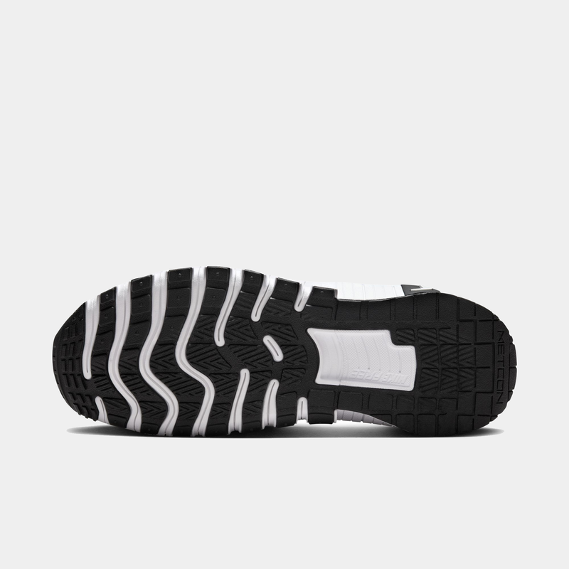 Nike Free Metcon 6 TB training shoe outsole in black rubber with white flex grooves, bottom view showing traction pattern.
