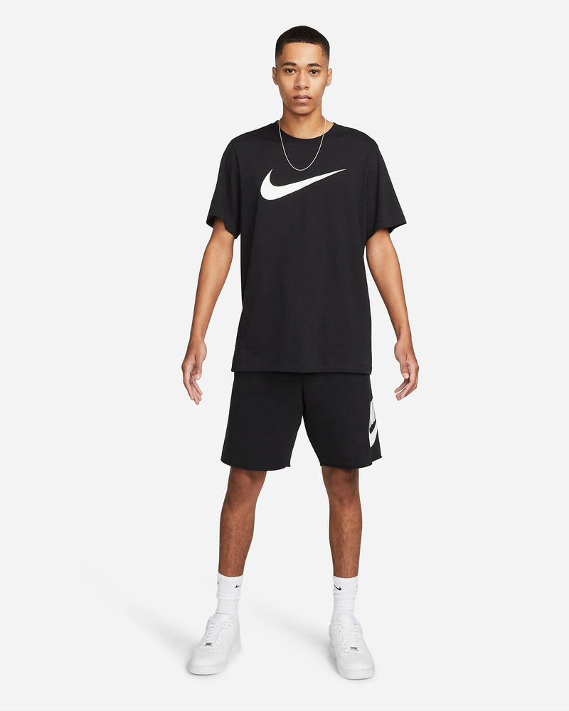 Nike French Terry Alumni Shorts in black with a white Nike logo on the left leg, front view, styled with casual wear.