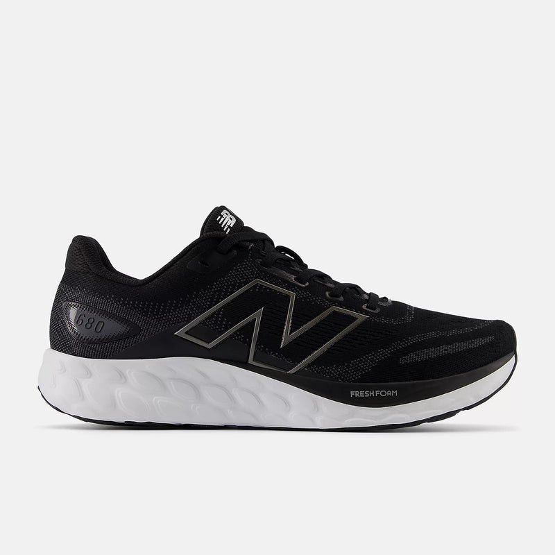 New Balance Fresh Foam 680v8 running shoes in black with mesh upper and cushioned white midsole, side view.