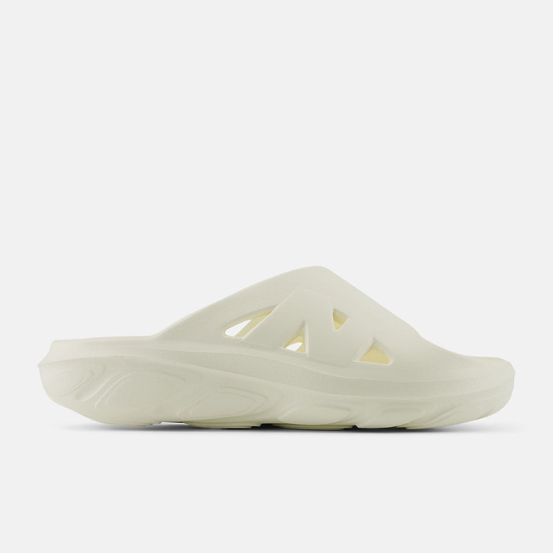 New Balance Fresh Foam RCVRY Slide sandals in cream white with cushioned foam sole and perforated upper, side view.