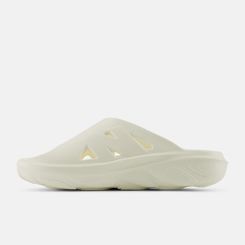 New Balance Fresh Foam RCVRY Slide sandals in pale cream with foam cushioning and perforated strap design, side view.