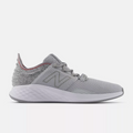 New Balance Golf Fresh Foam ROAV Golf shoes, side view in gray with knit upper, cushioned midsole, and red stitch accents.