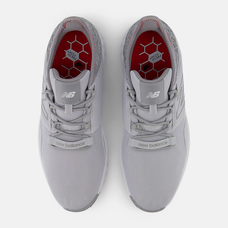 New Balance Golf Fresh Foam ROAV Golf shoes in light gray with mesh upper and red insoles, top view showing lace system.