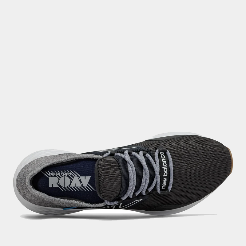 New Balance Fresh Foam Roav Tee Shirt running shoes top view, featuring black mesh upper, gray laces, and branded insole.