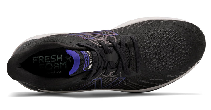 New Balance Fresh Foam Vongo v5 running shoes in black with purple accents, top view showing mesh upper and lace system.