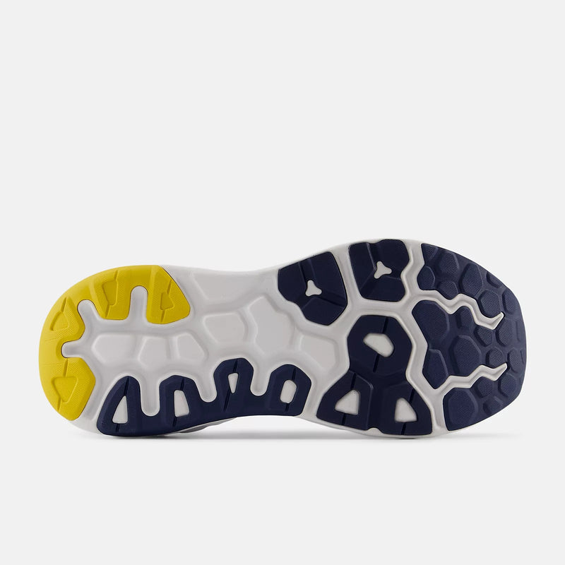 New Balance Fresh Foam X 840F running shoe outsole showing textured rubber tread in white, navy blue, and yellow.