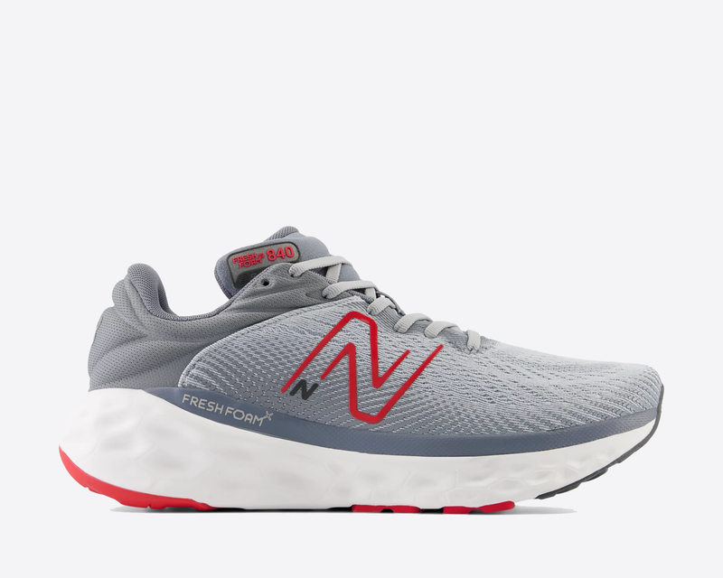 New Balance Fresh Foam X 840v1 running shoes in light gray with red accents, breathable mesh upper, and cushioned white midsole, side view.