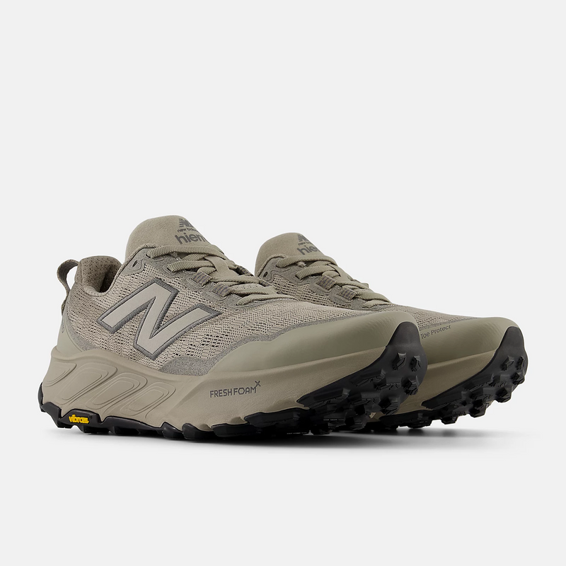 New Balance Fresh Foam X Hierro v9 trail running shoes in beige with a breathable mesh upper, reinforced toe protection, Vibram outsole, and Fresh Foam cushioning, angled front view.