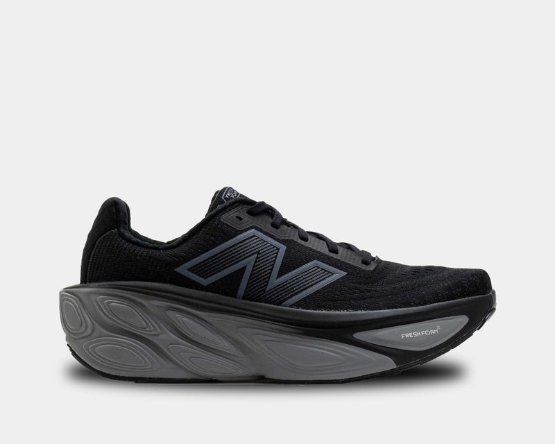 New Balance Fresh Foam X More v5 running shoes in black with a plush midsole and lightweight mesh upper, side view.