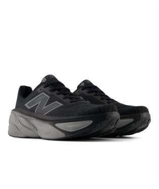 New Balance Fresh Foam X More v5 running shoes in black and gray with a cushioned midsole and mesh upper, front side angle.