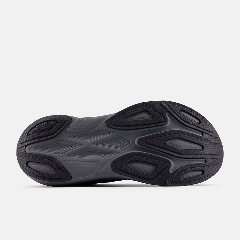 New Balance Fresh Foam X More v6 running shoes outsole showing black rubber traction pattern and cushioning grooves.