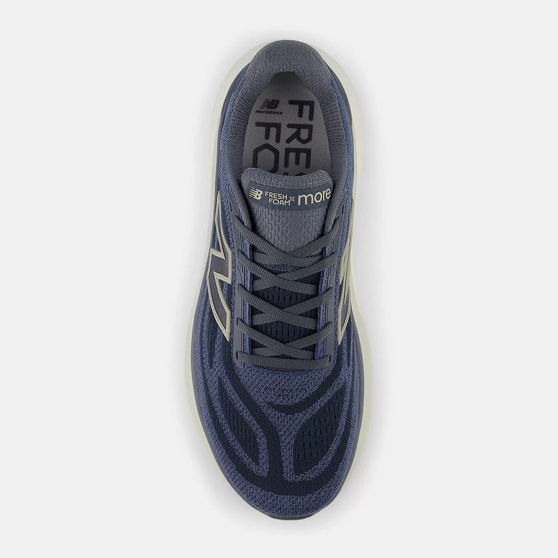 New Balance Fresh Foam X More v6 running shoes in navy blue with lightweight mesh upper and padded tongue, top view.
