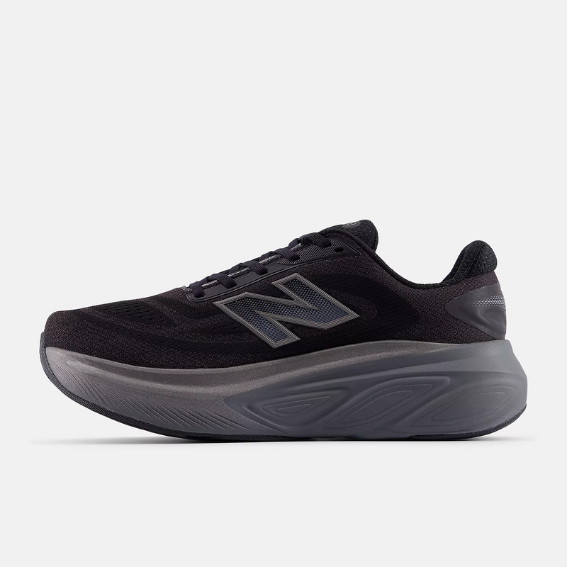 New Balance Fresh Foam X More v6 running shoes in black with cushioned midsole and mesh upper, side view.