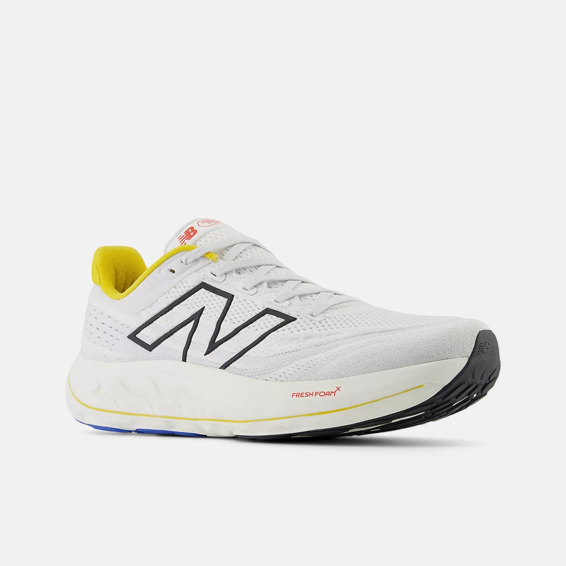 New Balance Fresh Foam X Vongo v6 running shoes in white with black logo, yellow accents, and cushioned midsole, front-side view.
