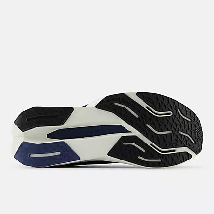 New Balance FuelCell Propel v5 running shoe outsole featuring black rubber tread and white accents, bottom view.