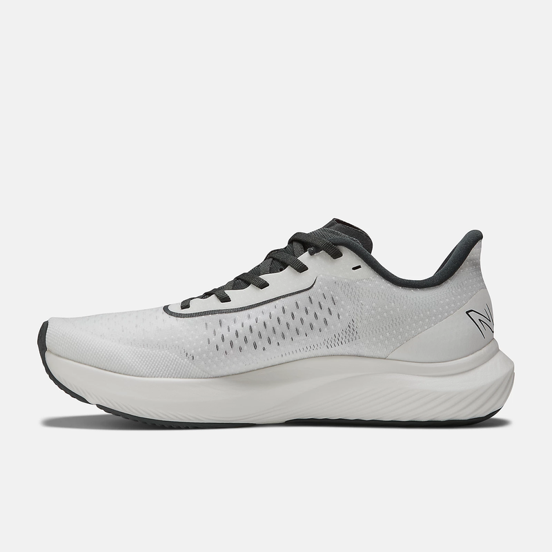 New Balance FuelCell Rebel v3 running shoes, side view showing white mesh upper, black accents, and lightweight cushioned midsole.
