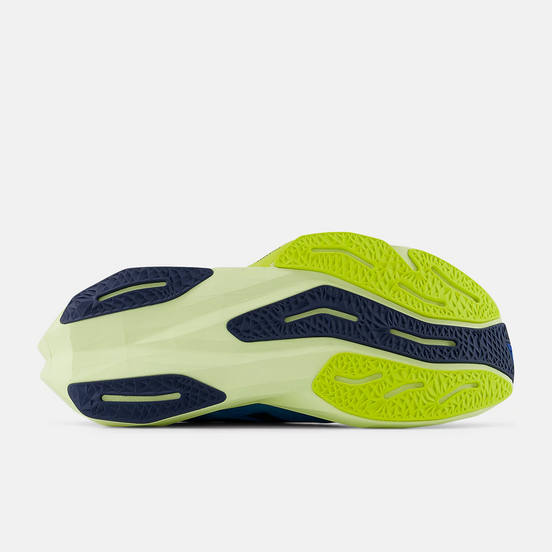 New Balance FuelCell Rebel v4 running shoes outsole with green and navy rubber tread pattern for traction, bottom view
