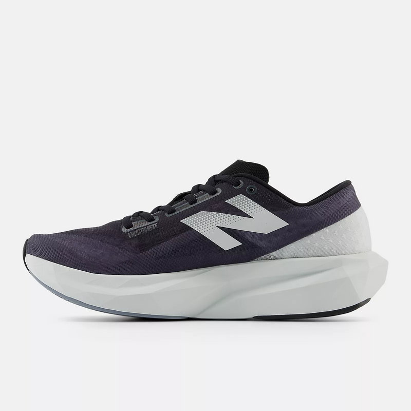 New Balance FuelCell Rebel v4 running shoes in dark purple and white with mesh upper and lightweight foam midsole, side view.