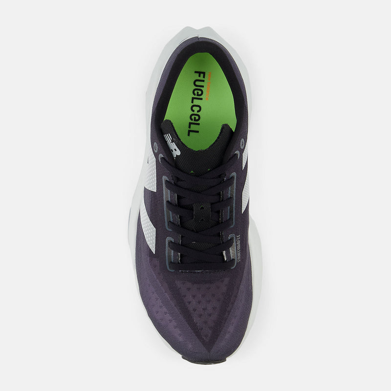 New Balance FuelCell Rebel v4 running shoes top view featuring purple mesh upper, white accents, black laces, and green insole.