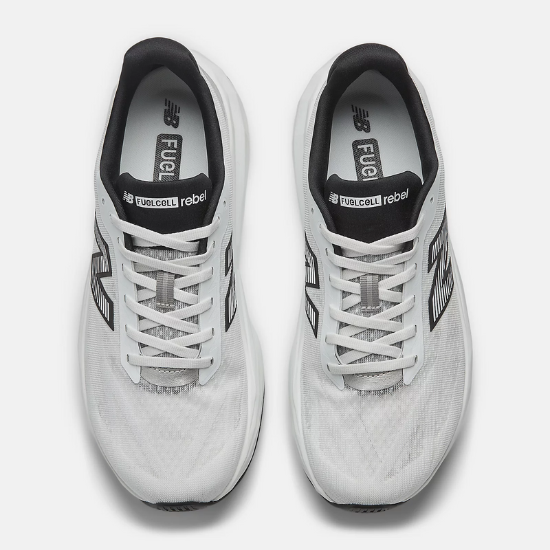 New Balance FuelCell Rebel v5 running shoes in white with black detailing, lightweight mesh upper and lace system, top view.