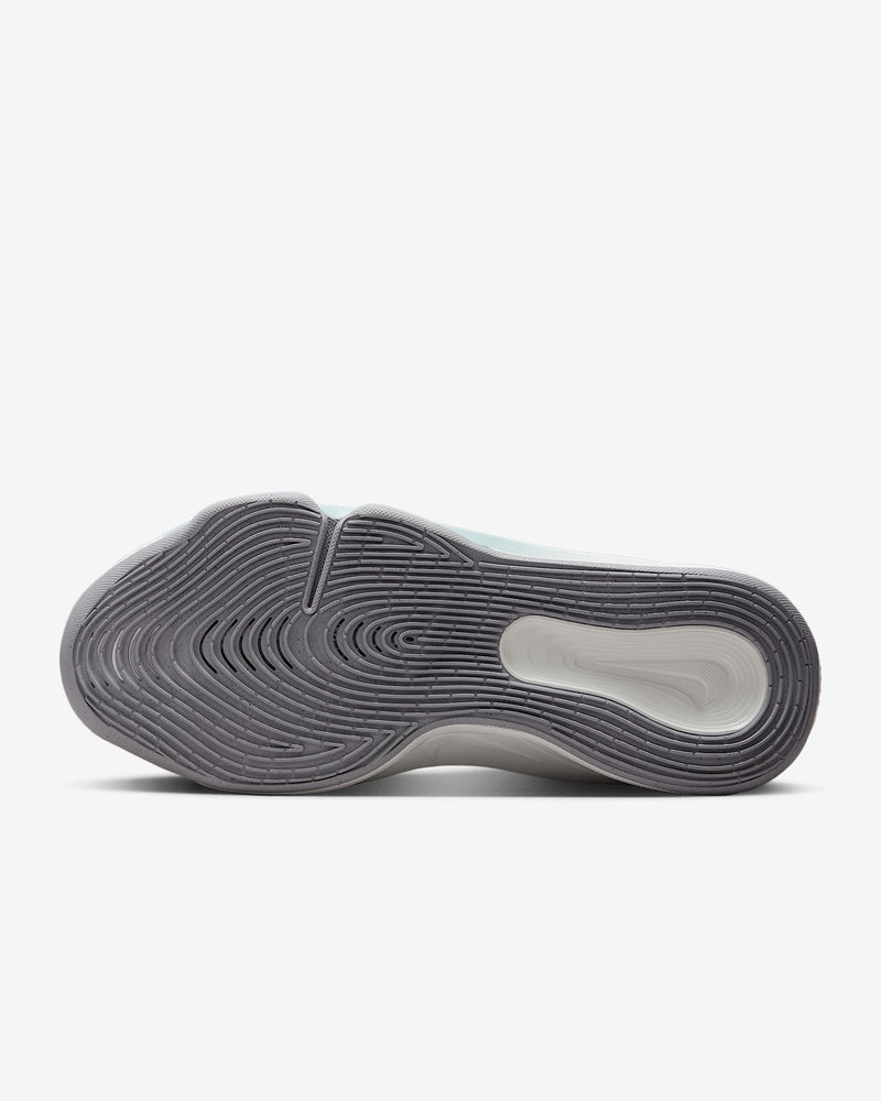 Nike G.T. Hustle 3 basketball shoes outsole with multidirectional traction pattern in gray and white rubber, bottom view.