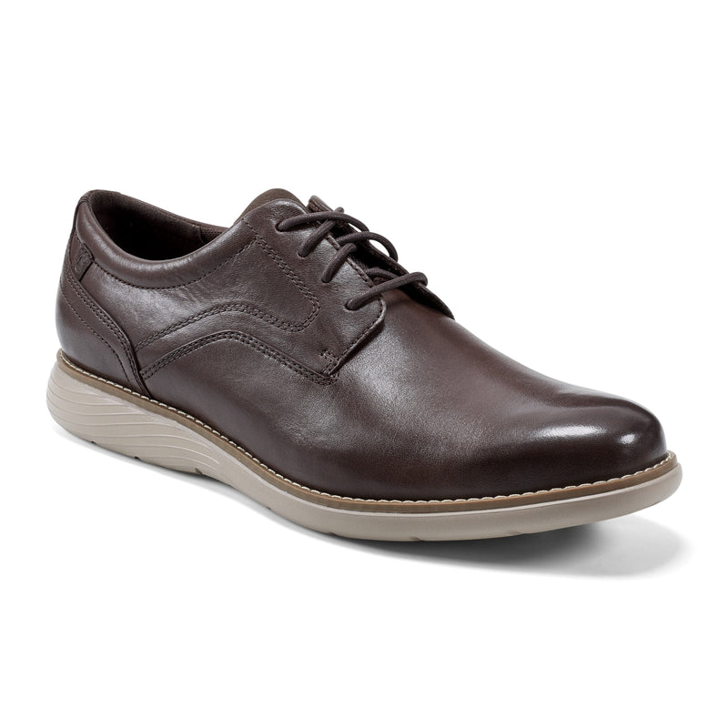 Rockport Garett Plain Toe shoes in dark brown leather with contrasting beige sole, front angled view showing plain toe design and lace-up closure.