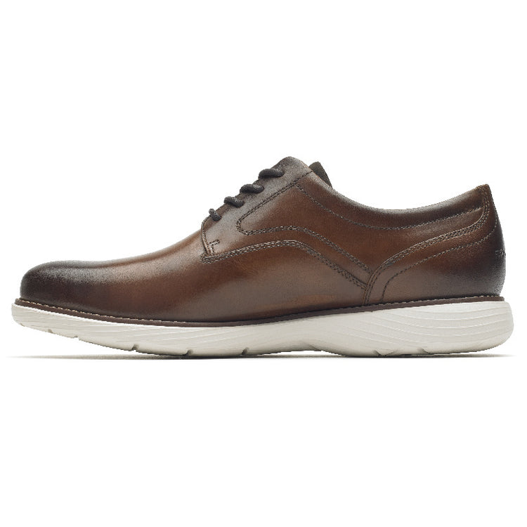 Rockport Garett Plain Toe shoes in brown leather with stitch detailing and white rubber sole, side view.
