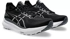 Asics Gel-Kayano 31 running shoes in black with white accents, engineered mesh upper, and cushioned midsole, front-side view.