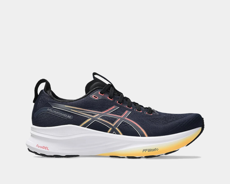 Asics Gel-Kayano 32 running shoes, side view in navy blue with yellow-to-orange gradient midsole, PureGEL cushioning, and breathable mesh upper.