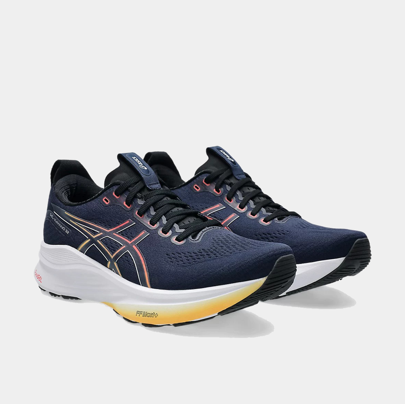 Asics Gel-Kayano 32 running shoes in navy blue with FlyteFoam cushioning and orange accents, front angled view.